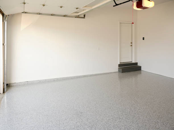 Finished garage interior with epoxy flooring and white walls